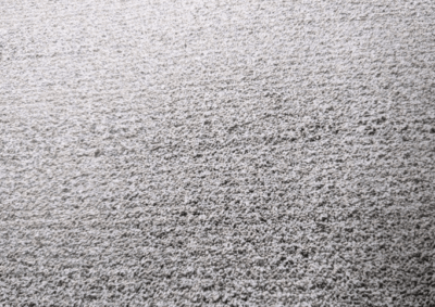 Close-up textured surface of pale granules